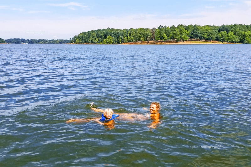 A group of people swimming in a body of water