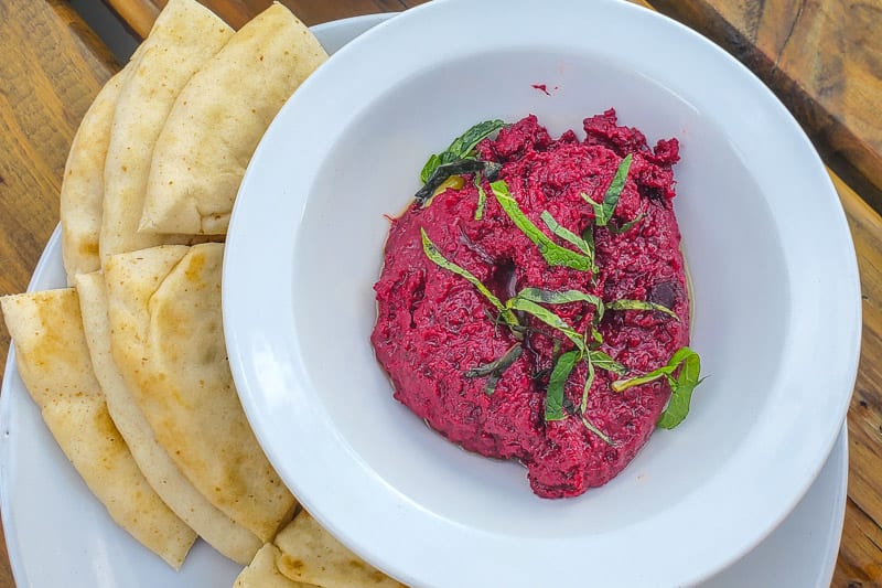 A plate of beet hummus and pita Wye Hill Restaurant RAleigh