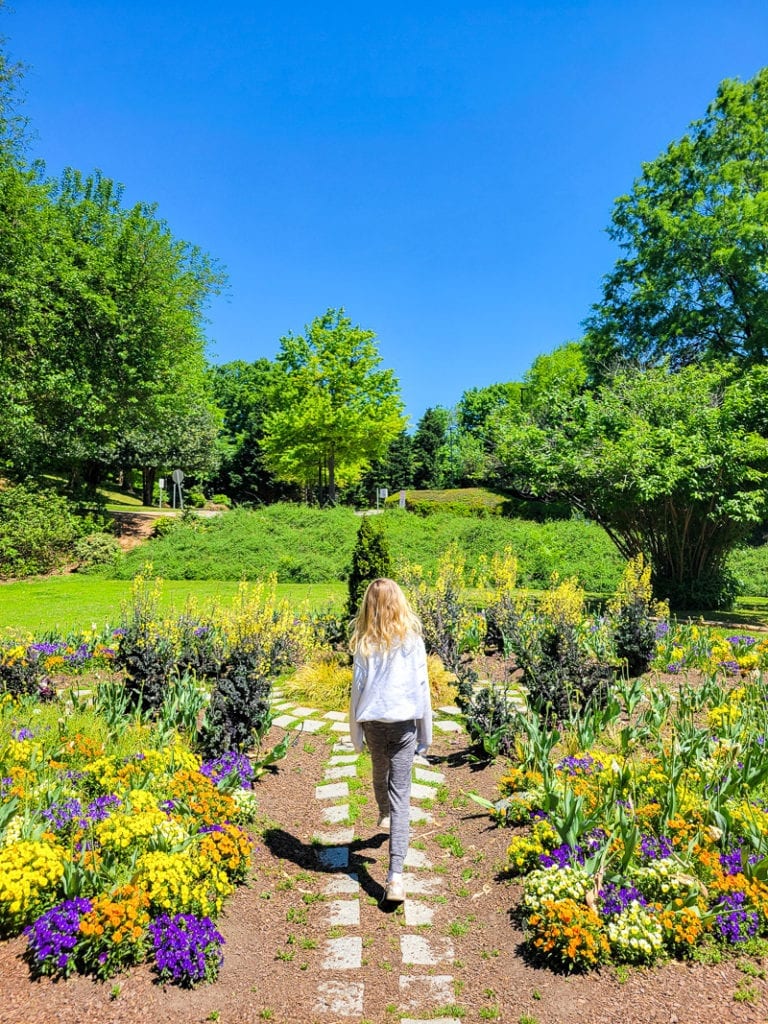 A girl standing in a garden