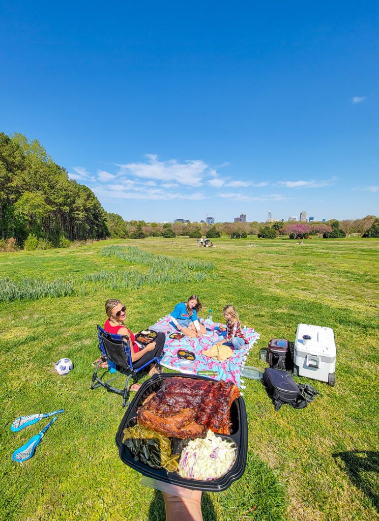family having picnic in Dorothea Dix Park, Raleigh
