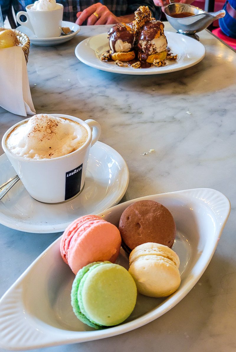 a plate of macaroons and a cup of coffee Coquette raleigh