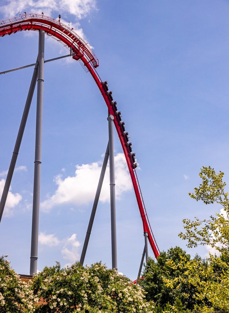Roller coaster dropping down hill at Carowinds Amusement Park
