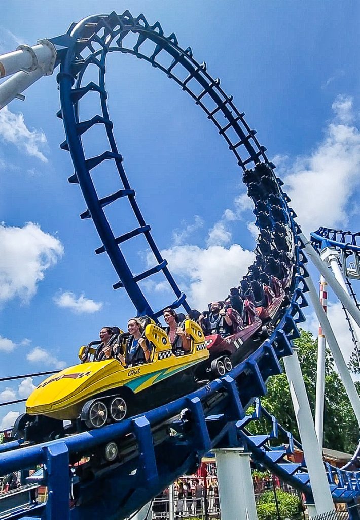 People riding a rollercoaster at Carowinds Amusement Park