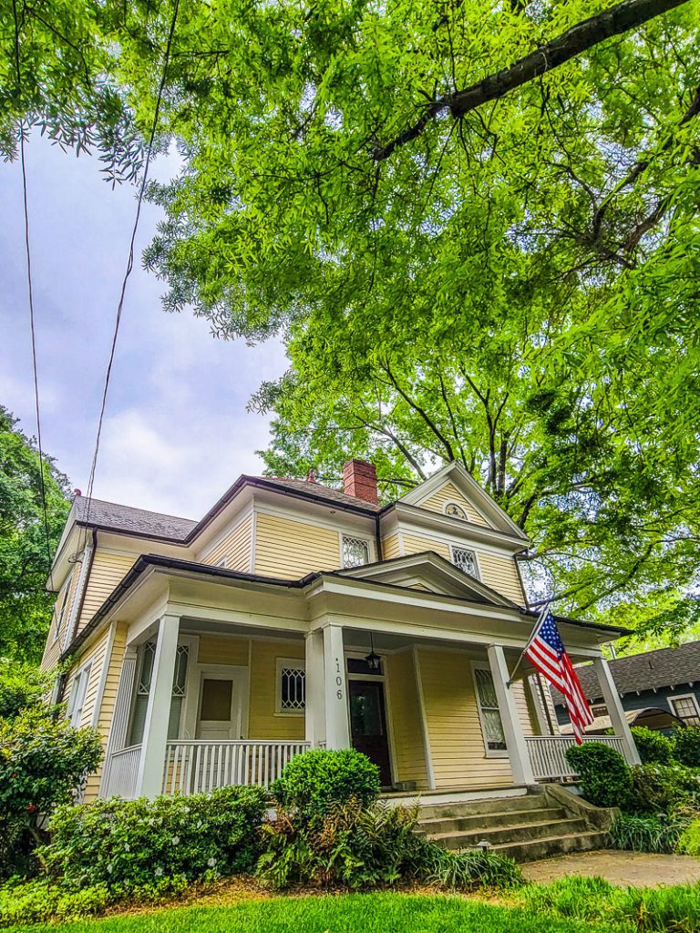 Historic home in oakwood covered with oak tree