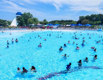 A group of people swimming in the water at Wet'nWild water park greensboro