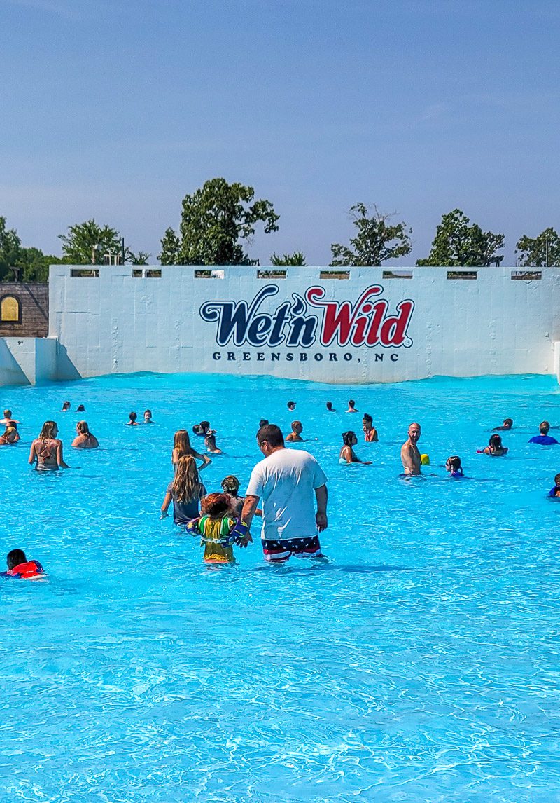A group of people swimming in the wave pool Wet\'n Wild Greensboro