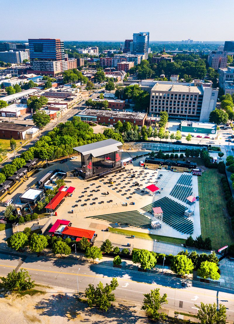 aerial view of red hat amphitheater with Raleigh skyline 