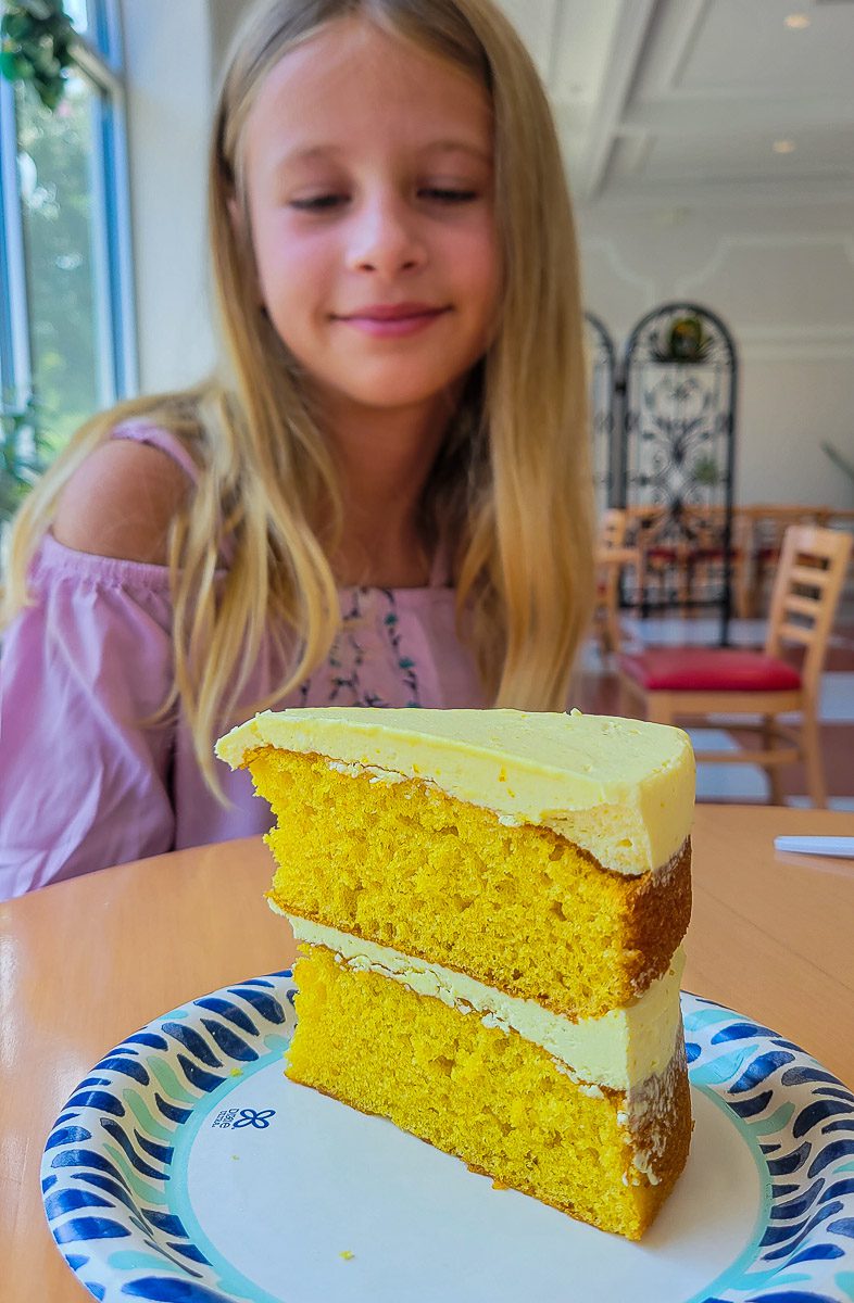 Girl with a piece of lemon cake