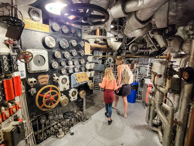 Mother and dughter exploring a navy war ship