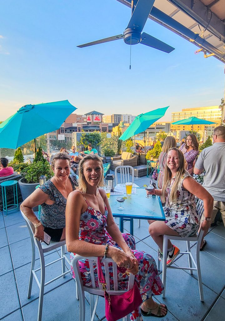 Ladies enjoying a few drinks on a rooftop bar
