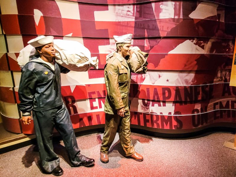 Two military displays inside a museum