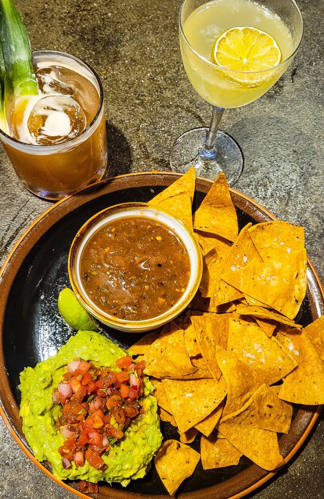 Chips and salsa with two cocktails