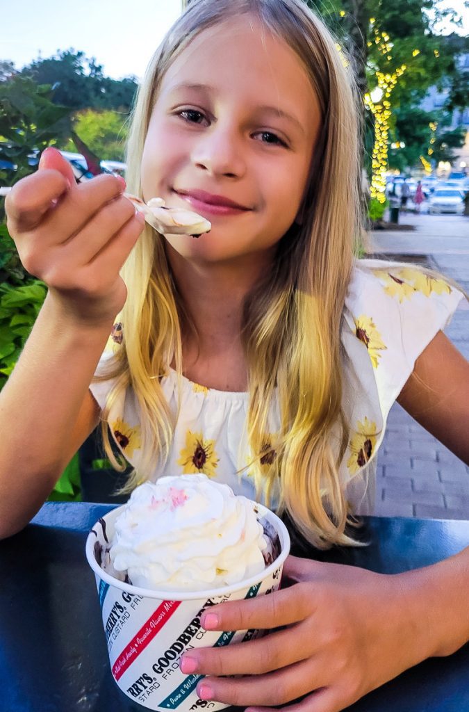 Girl eating ice cream from a cup