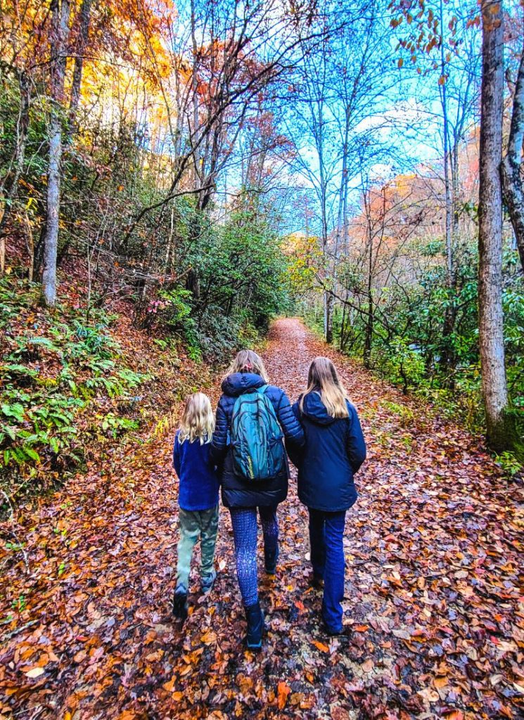 Mom and two daughters on a hiking trail in the Smoky Mountains