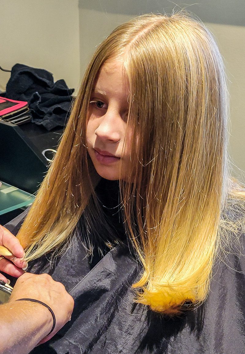 Girl getting her hair cut