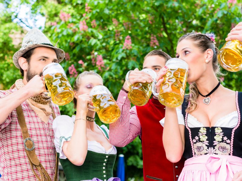 Group of friends drinking beer together at Oktoberfest