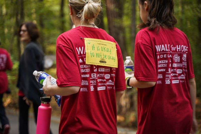 girls in walk for hope t-shirts in the forest