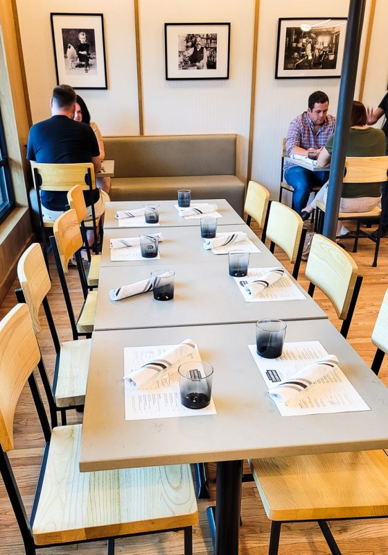 People dining at tables at a restaurant