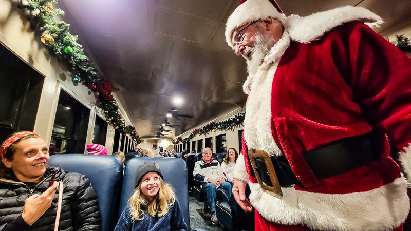 Santa talking to a child on a train - The Polar Express