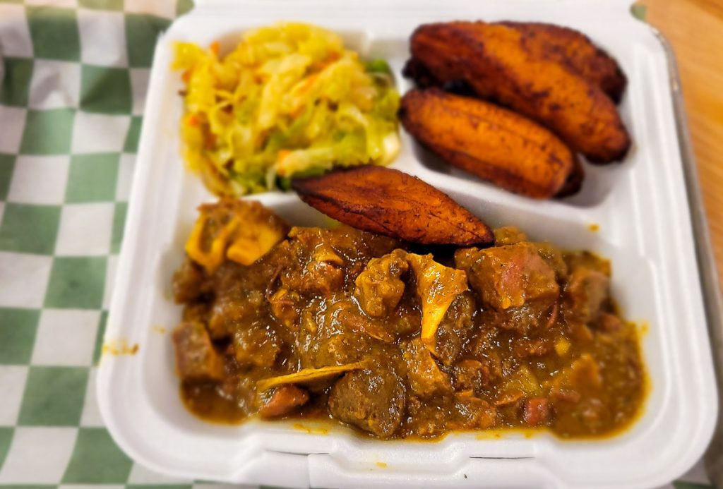 Plate of chicken curry and plantains
