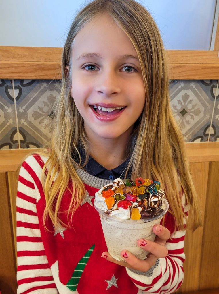 Girl holding a yoghurt