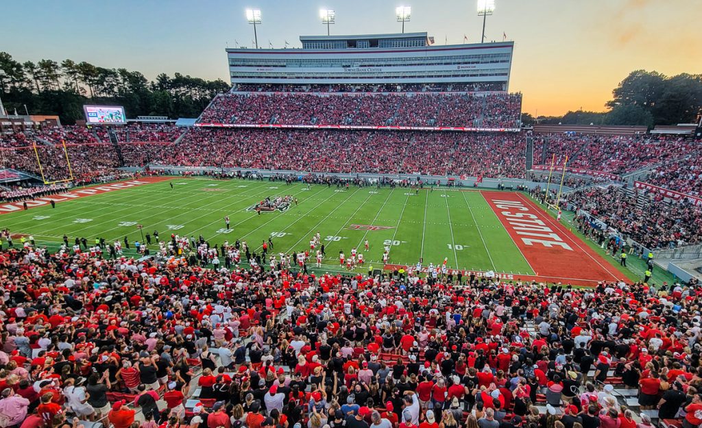 Fans watching a college football game at a stadium in Raleigh