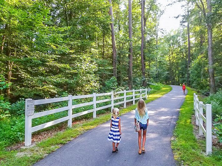Two young girls walking along a Greenway trail
