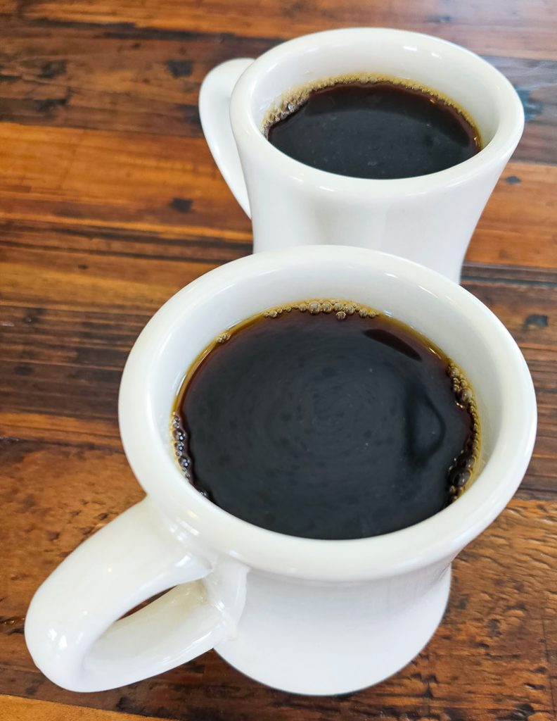 Two cups of black coffee