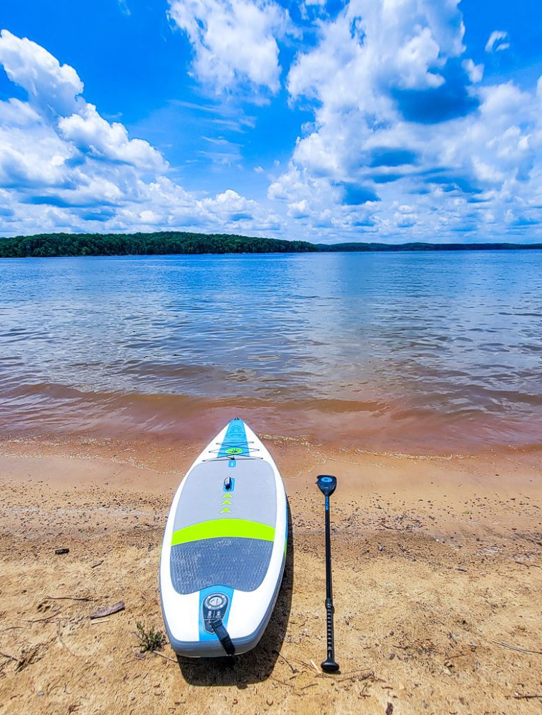 Stand up paddle board at the edge of a lake