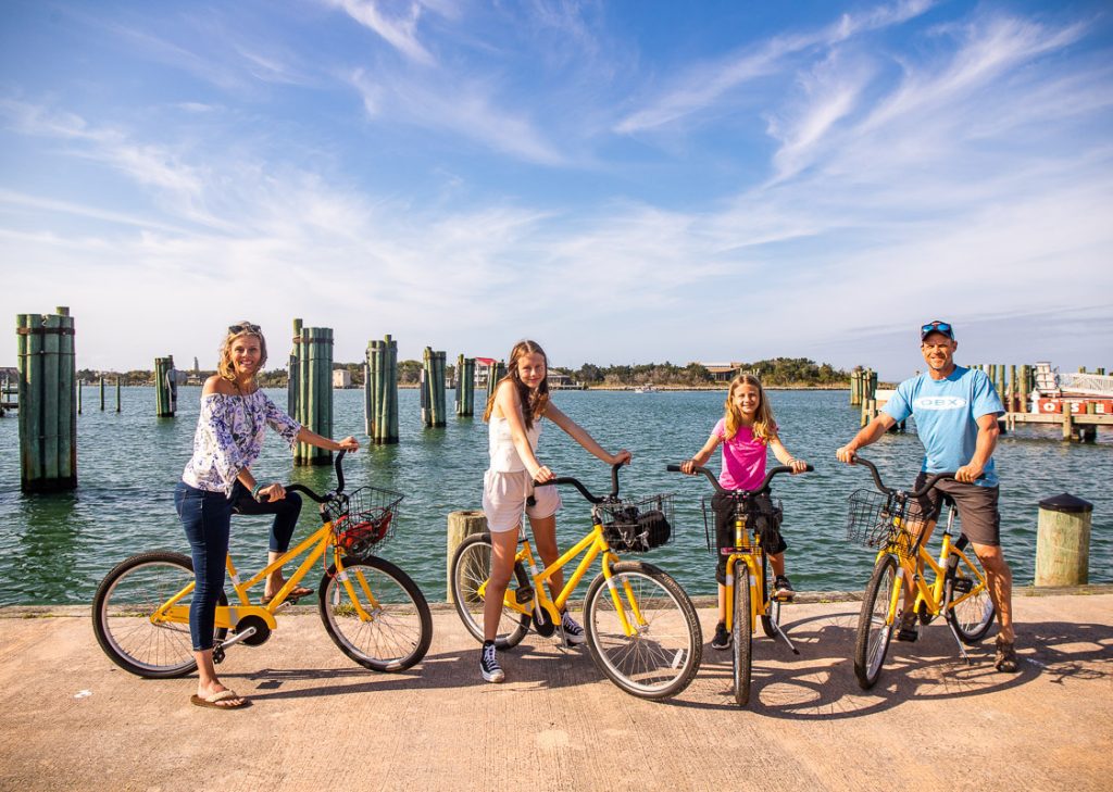 Family of four sitting on bikes