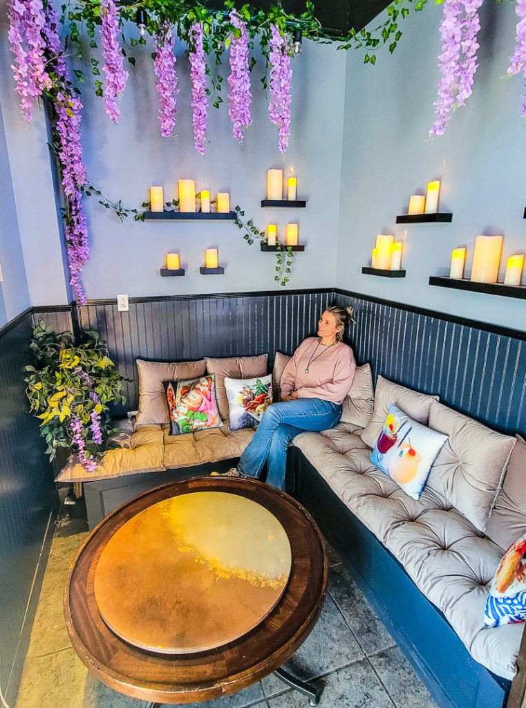Lady sitting on a couch in a restaurant