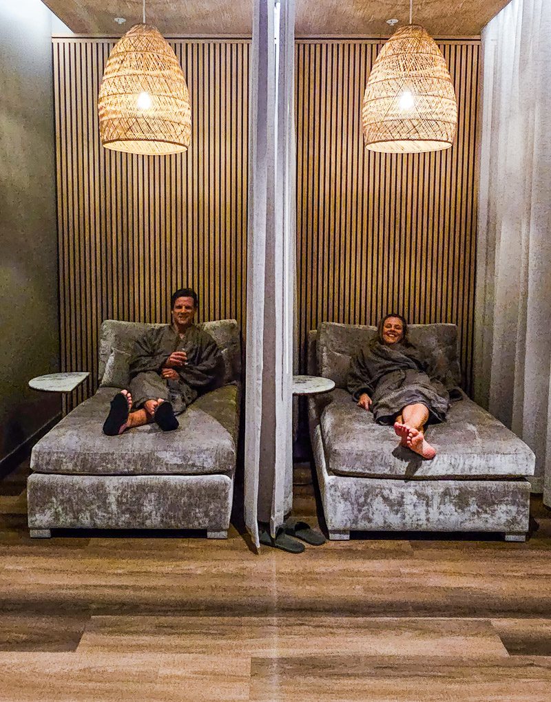 Couple sitting in a chairs relaxing at a spa retreat