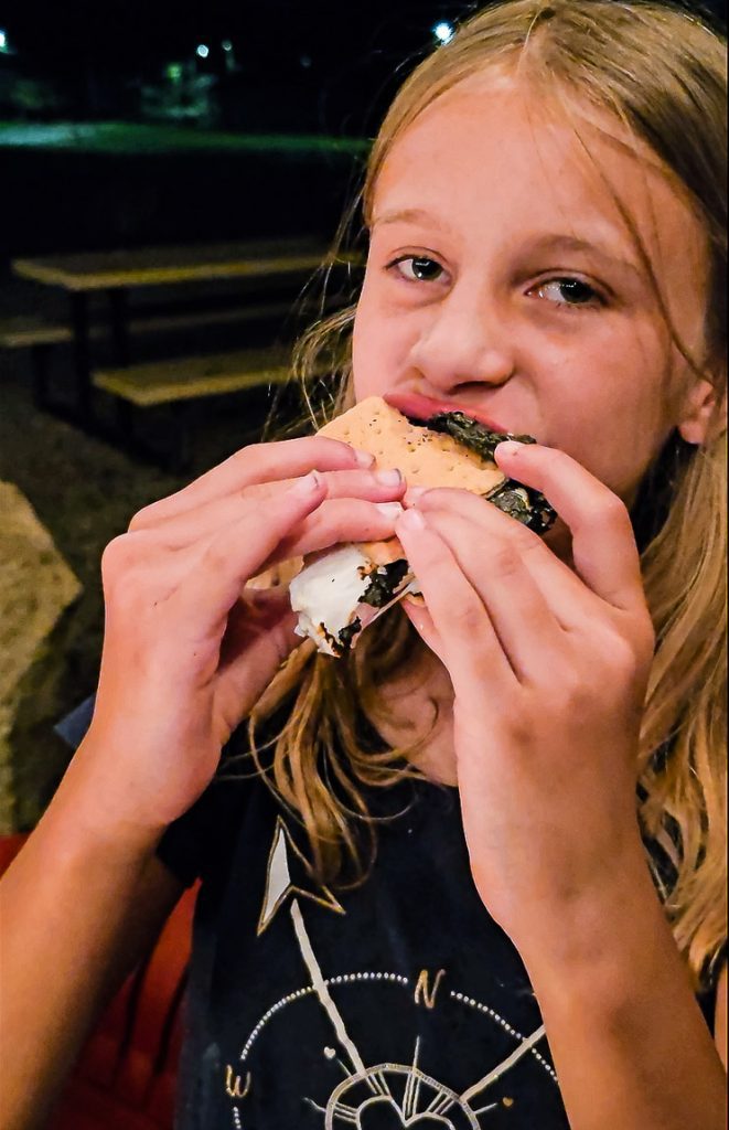 Girl eating a s'more
