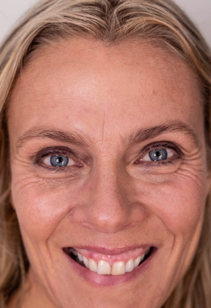 A closeup photo of a lady's face