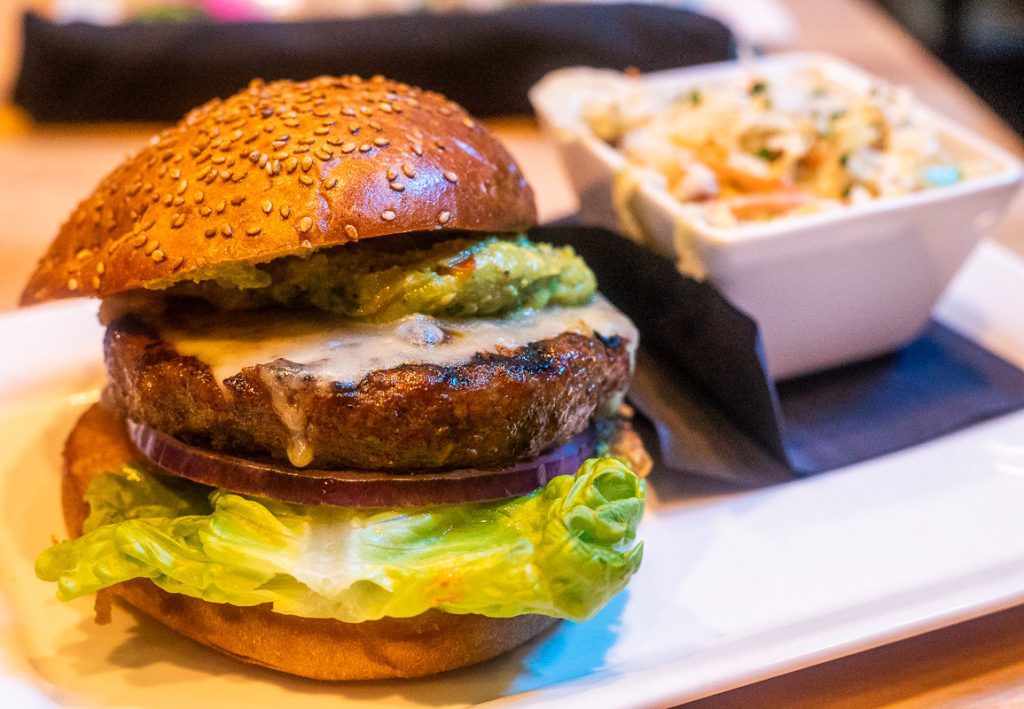 Burger with cheese and lettuce at Cowfish in North Hills