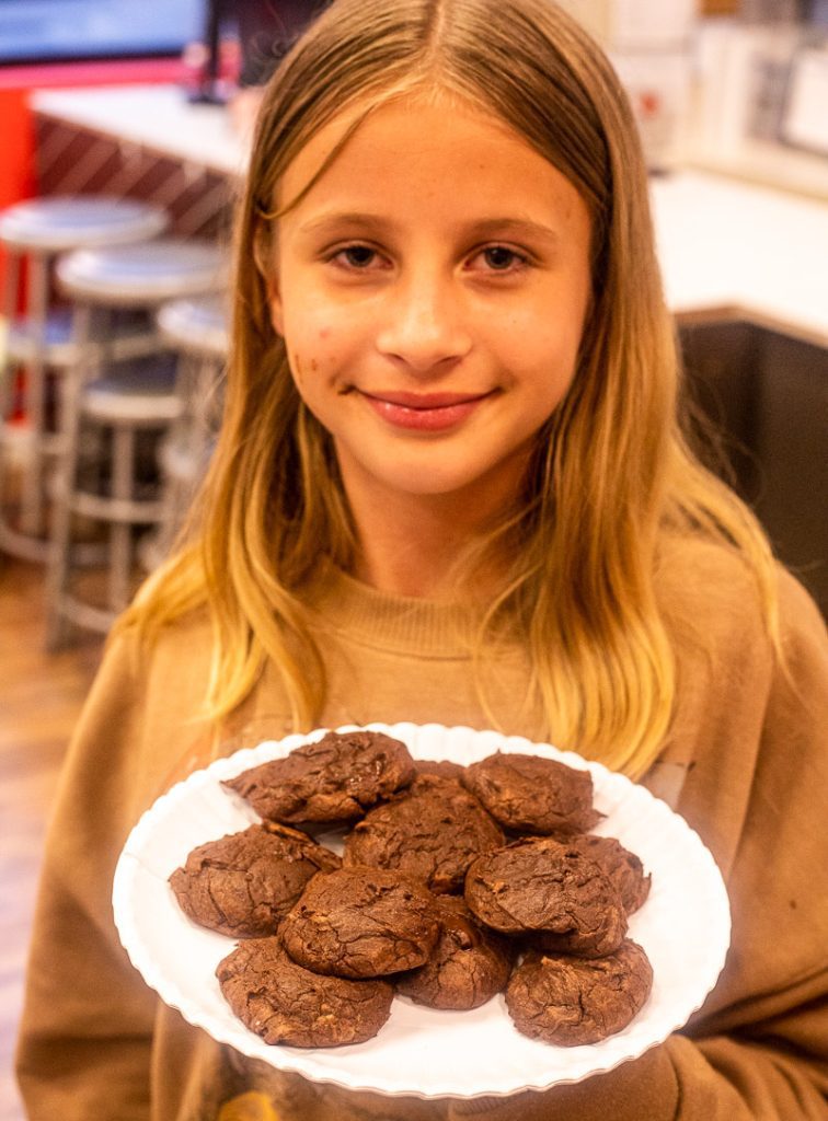 Savannah Makepeace holding up a plate of brownies
