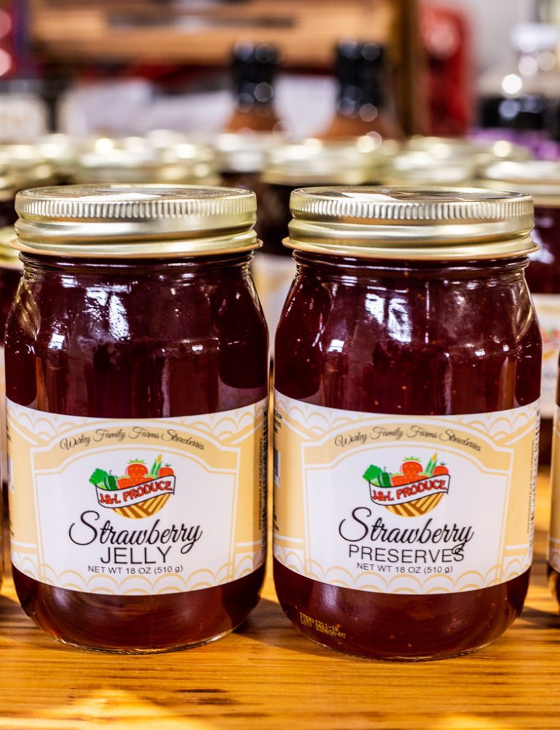 Two jars of strawberry jelly and preserve