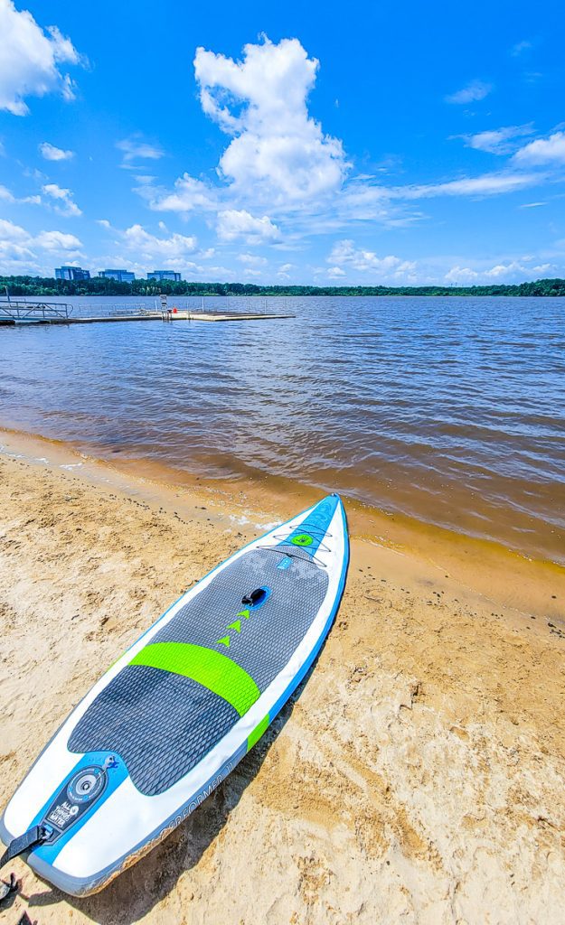 Paddle board at the edge of a lake
