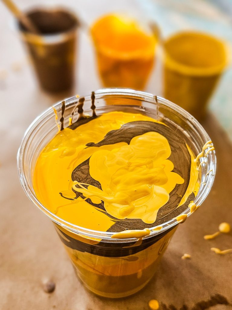 Cup of yellow paint