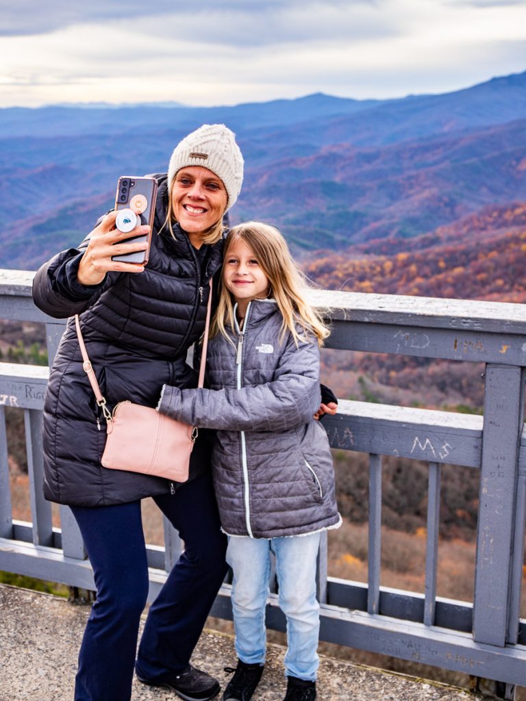 Mom and daughter taking a selfie in the mountains