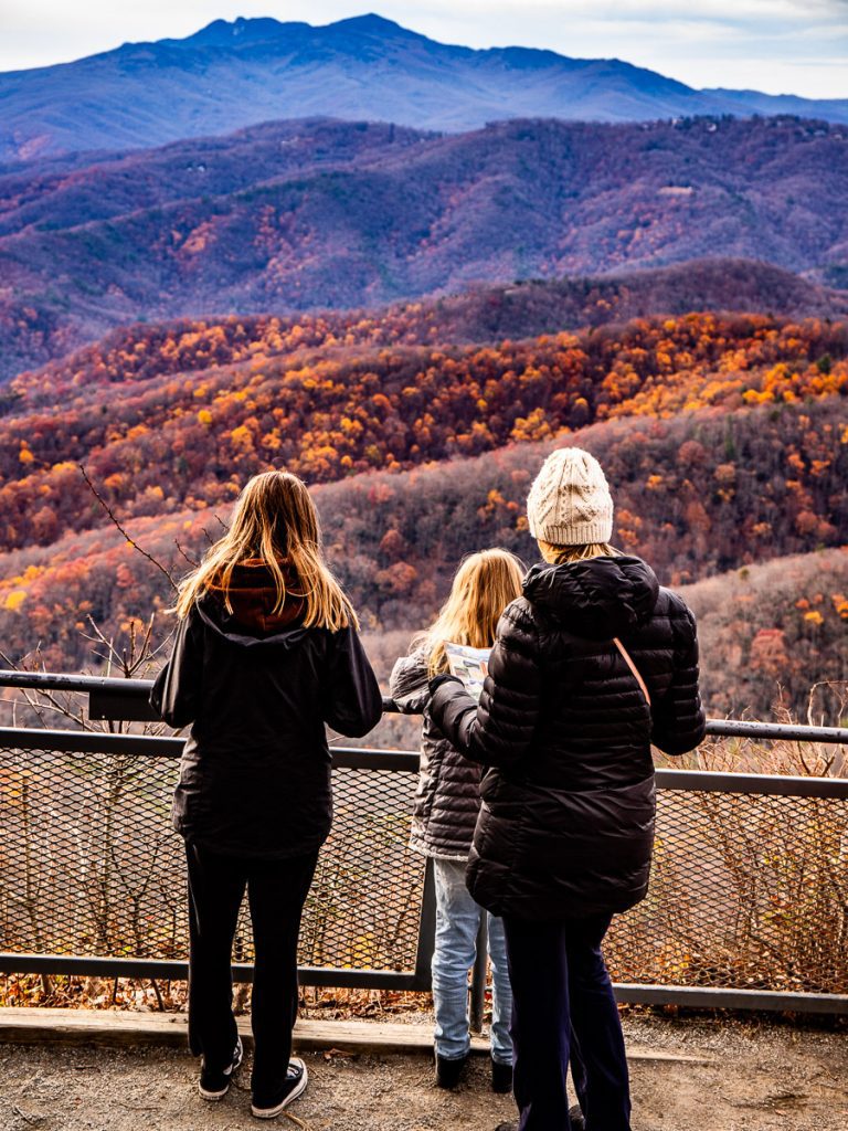 Mom and daughters looking out over the mountains