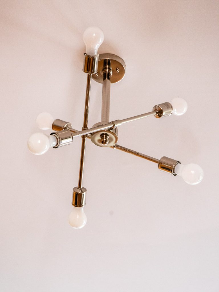 6 bulb chandelier hanging from ceiling