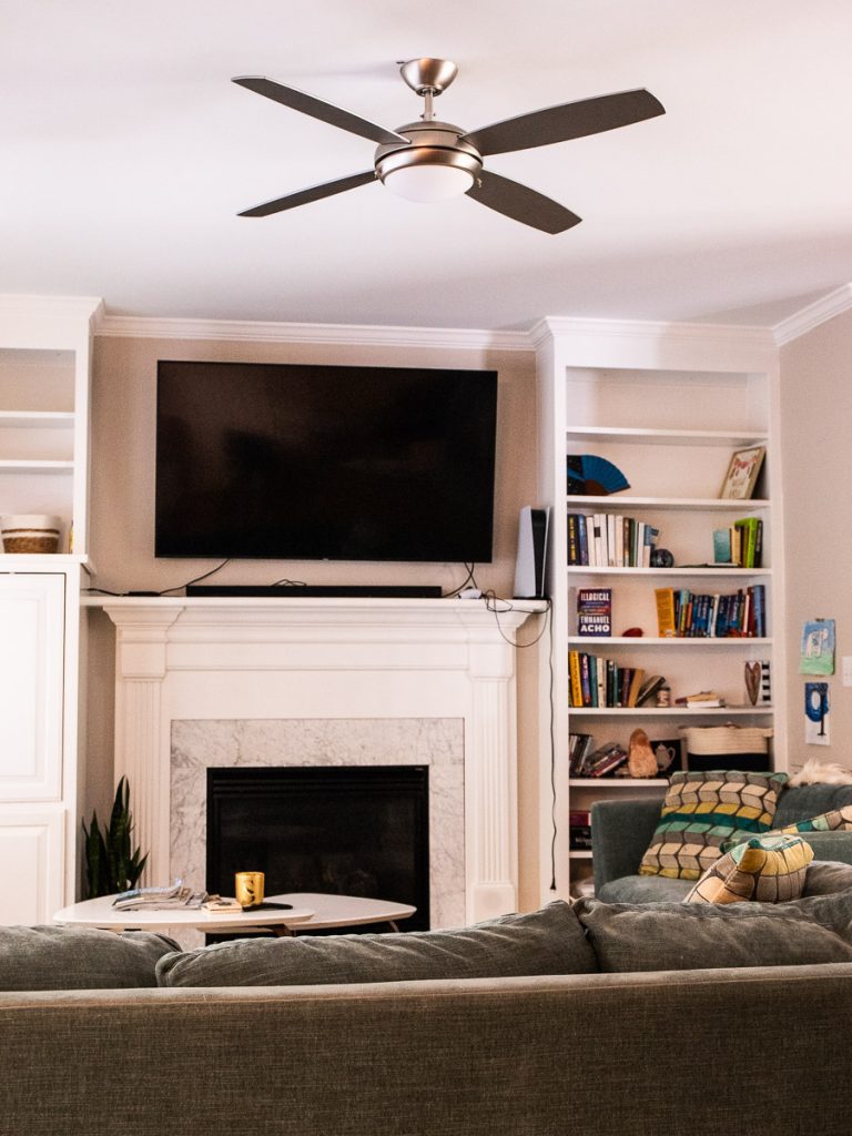 Living room with TV, couch and ceiling fan