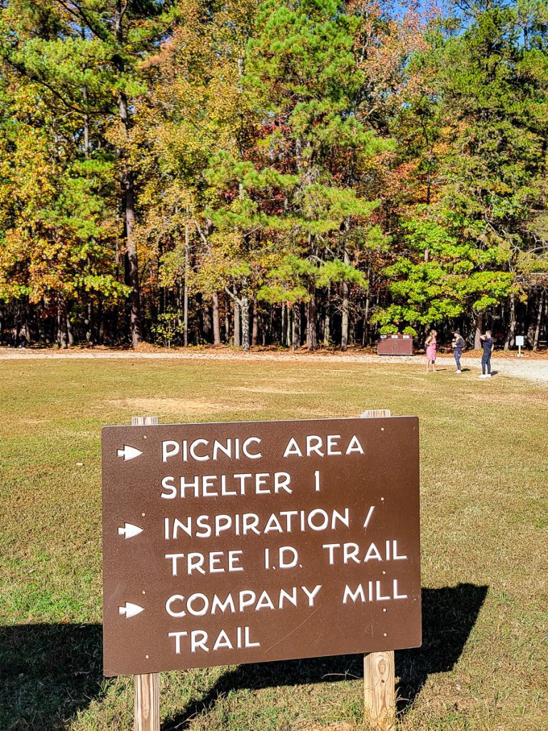 Sign in a park with directions to trails