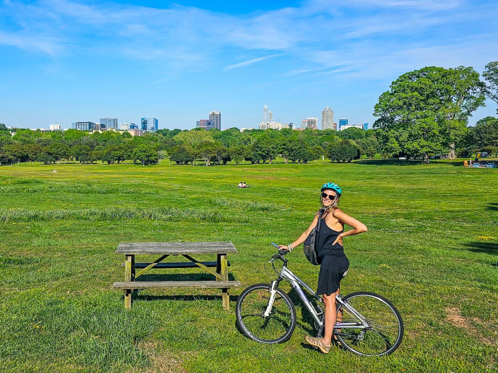 Woman riding a bike in a city park