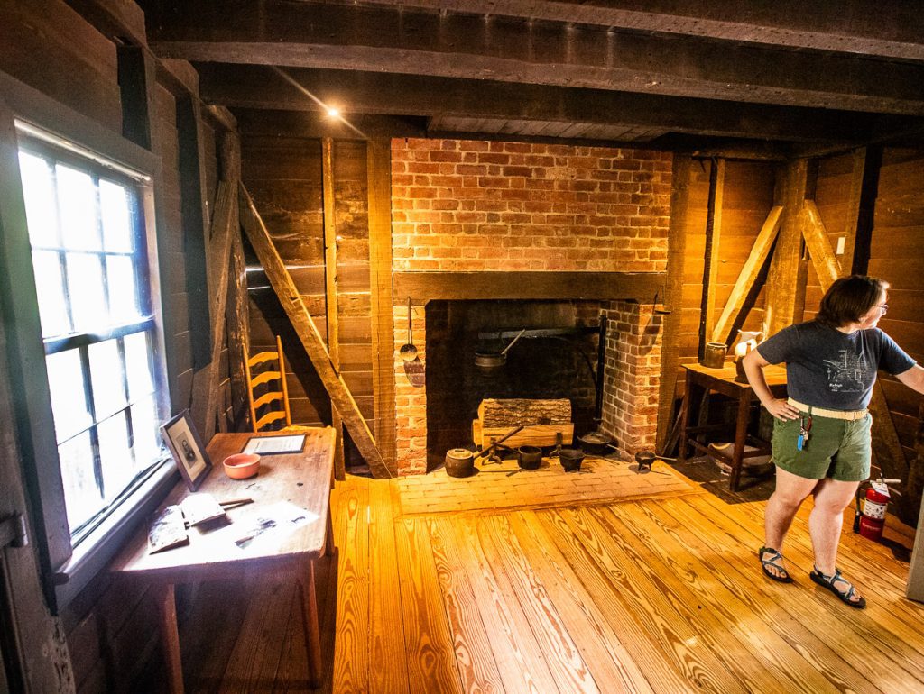 Lady inside an historic cottage