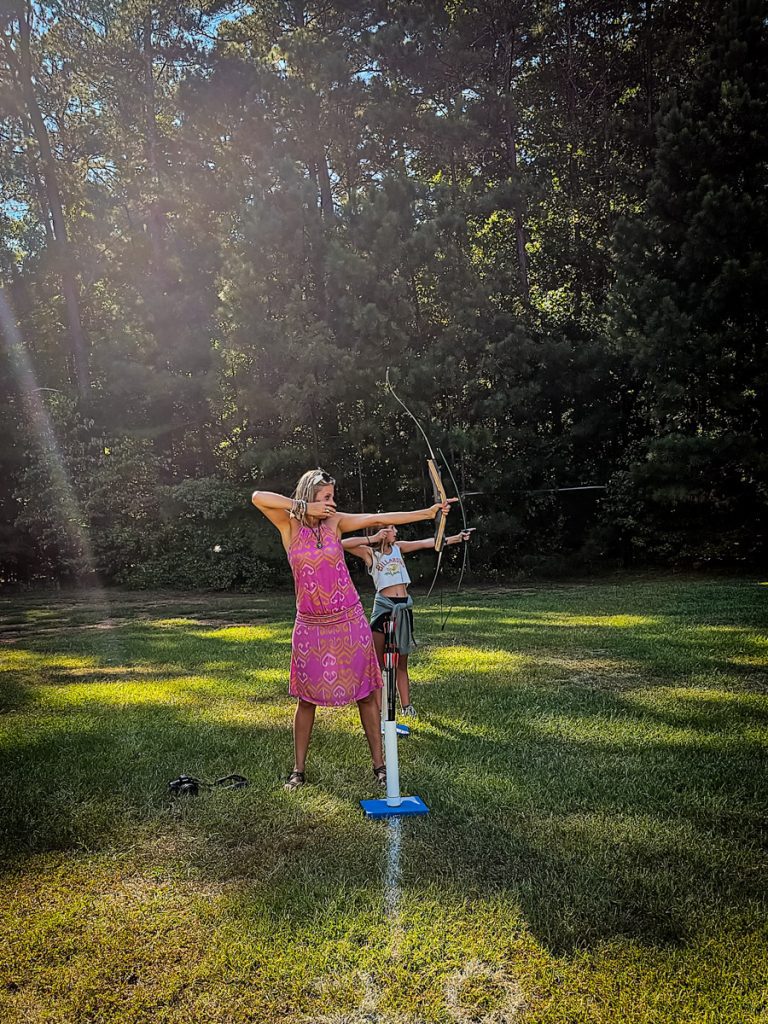 mother and daughter doing archery