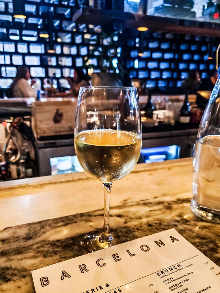 Glass of wine on a bar.