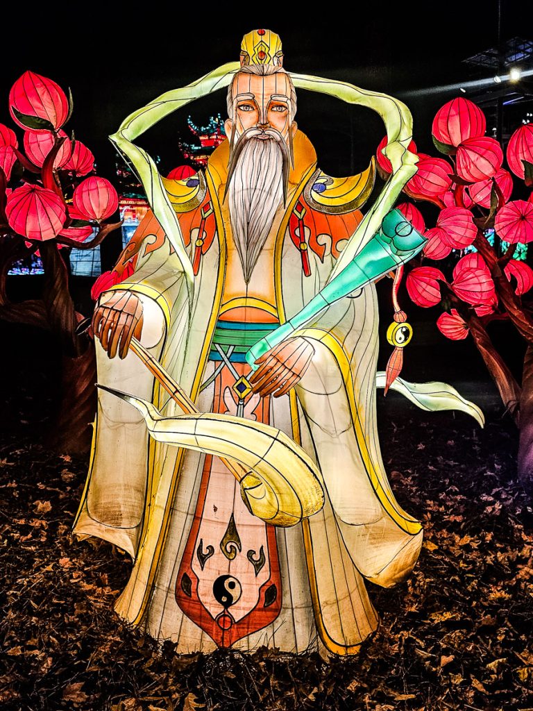 Illuminated Chinese man at a light festival.