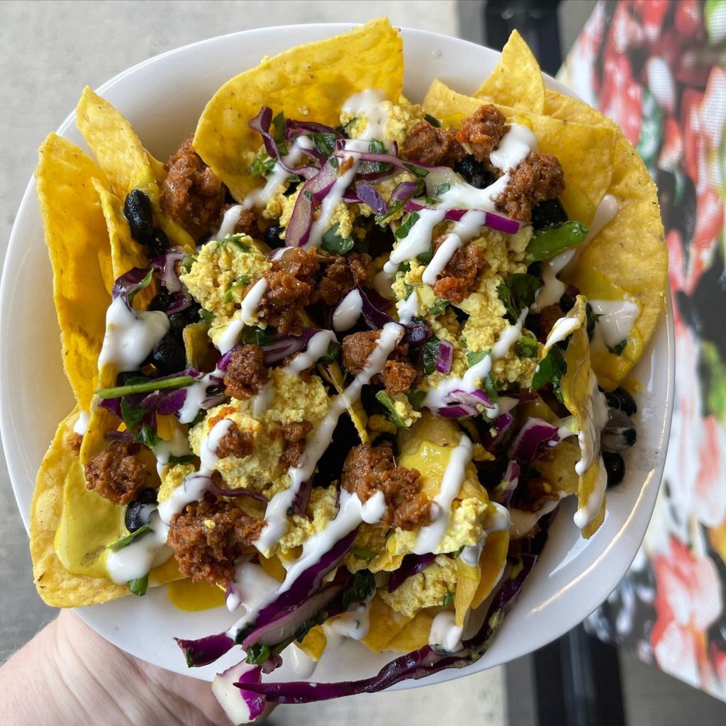 Nachos bowl with vegan toppings by Earth To Us.